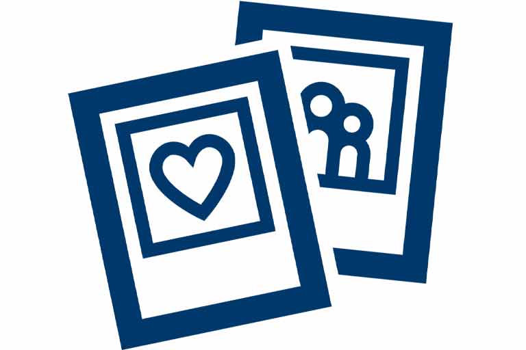 Line drawing of a card with a heart in front of a card with two stick figures